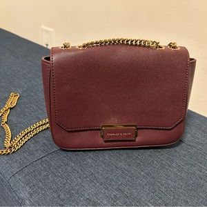 Wine coloured crossbody from Charles & Keith